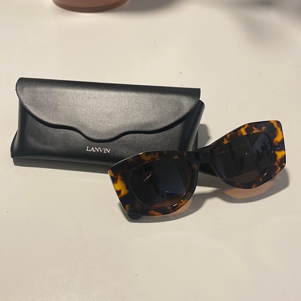 Brand new Lanvin sunglasses for women. Black and white wings with brown frame.